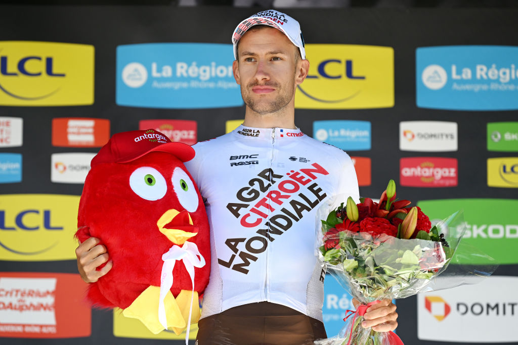 GAP FRANCE JUNE 10 Geoffrey Bouchard of France and AG2R Citren Team celebrates winning the trophy for the most combative rider on the podium ceremony after the 74th Criterium du Dauphine 2022 Stage 6 a 1964km stage from Rives to Gap 742m WorldTour Dauphin on June 10 2022 in Gap France Photo by Dario BelingheriGetty Images