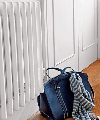 room with wooden flooring radiators