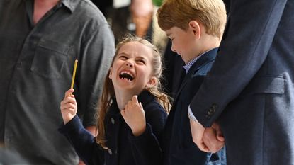 Princess Charlotte laughing with Prince George