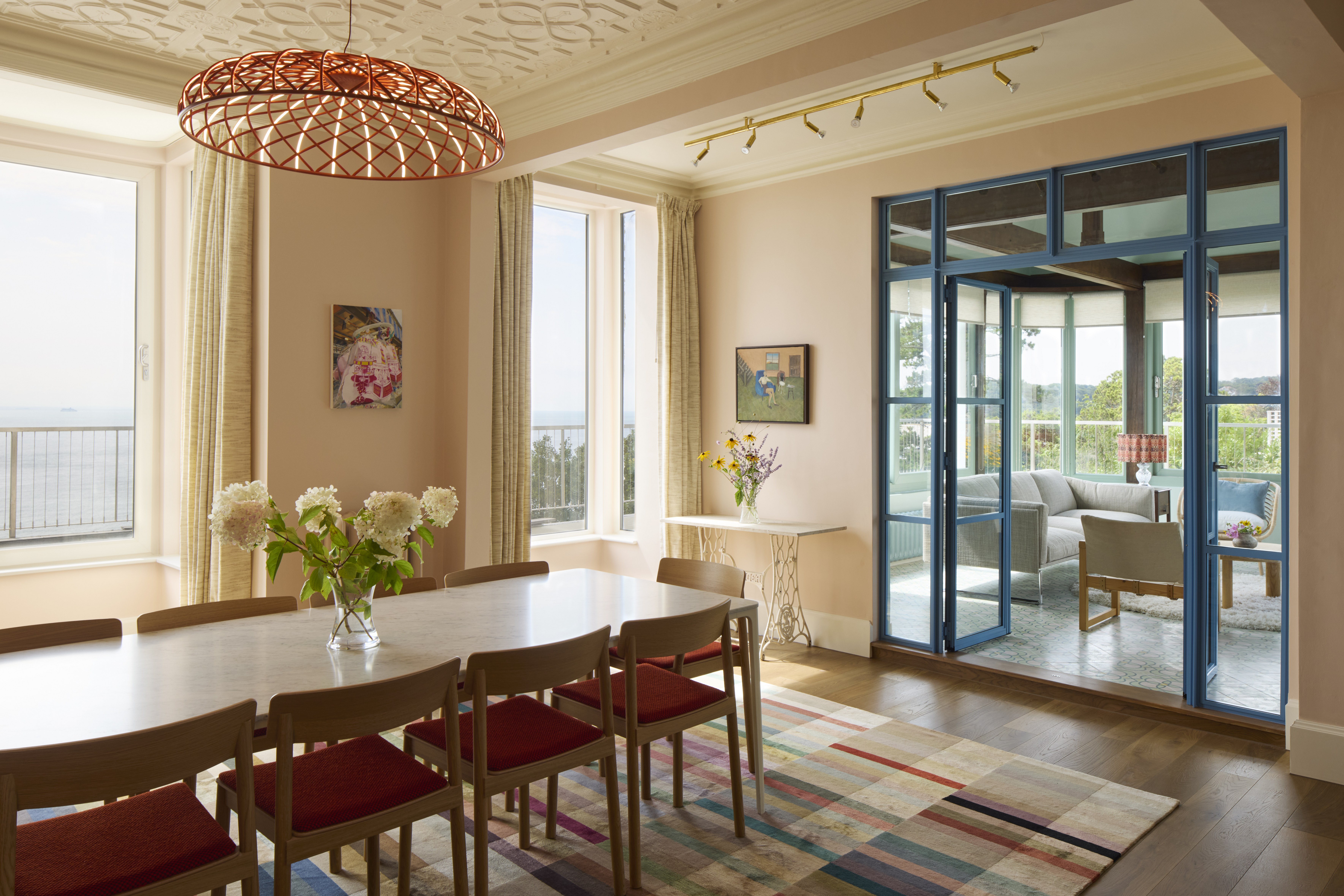 dining room with wooden flooring and leading to conservatory