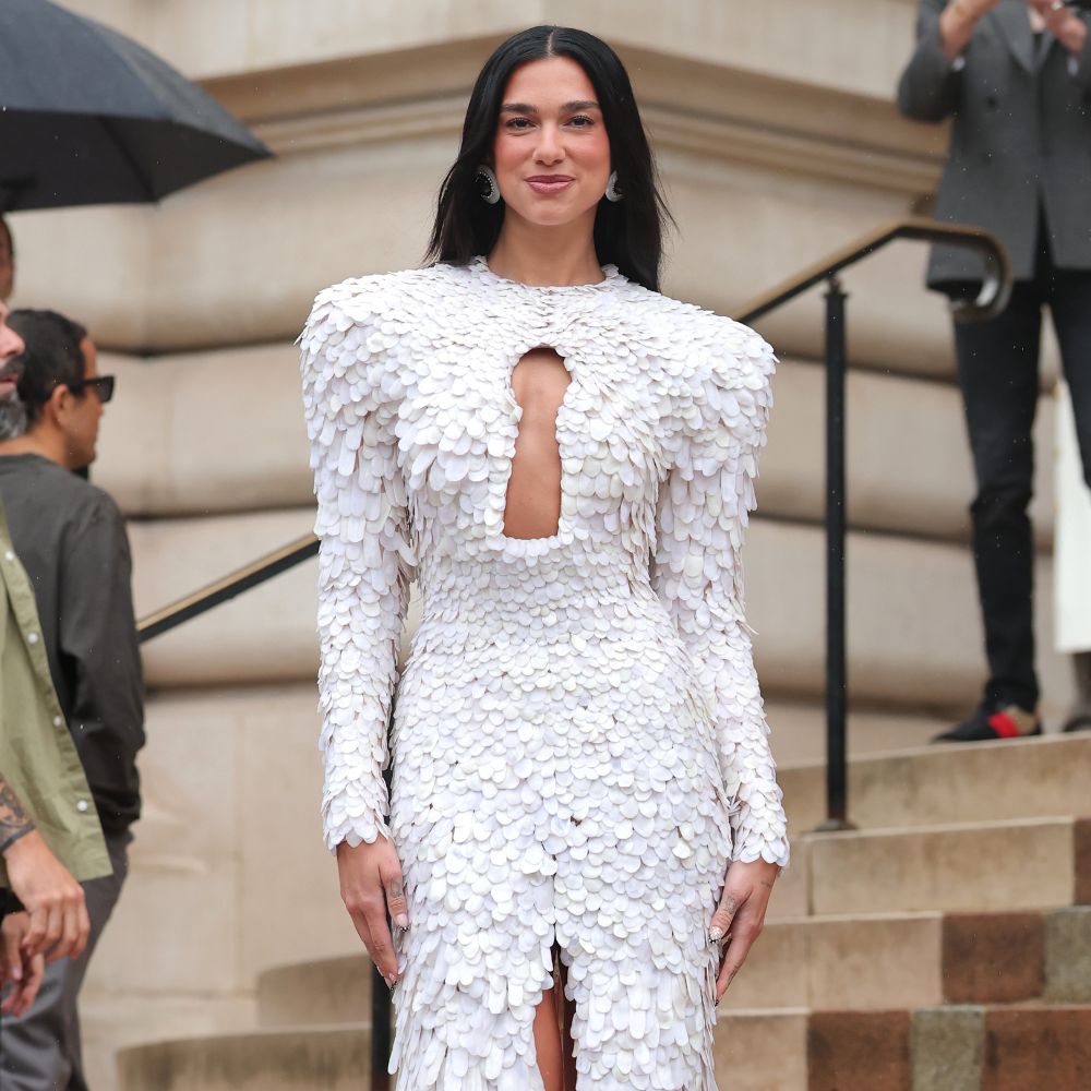 Dua Lipa wears a textured dress with key hole detailing for the Schiaparelli runway show at Paris Haute Couture Week.