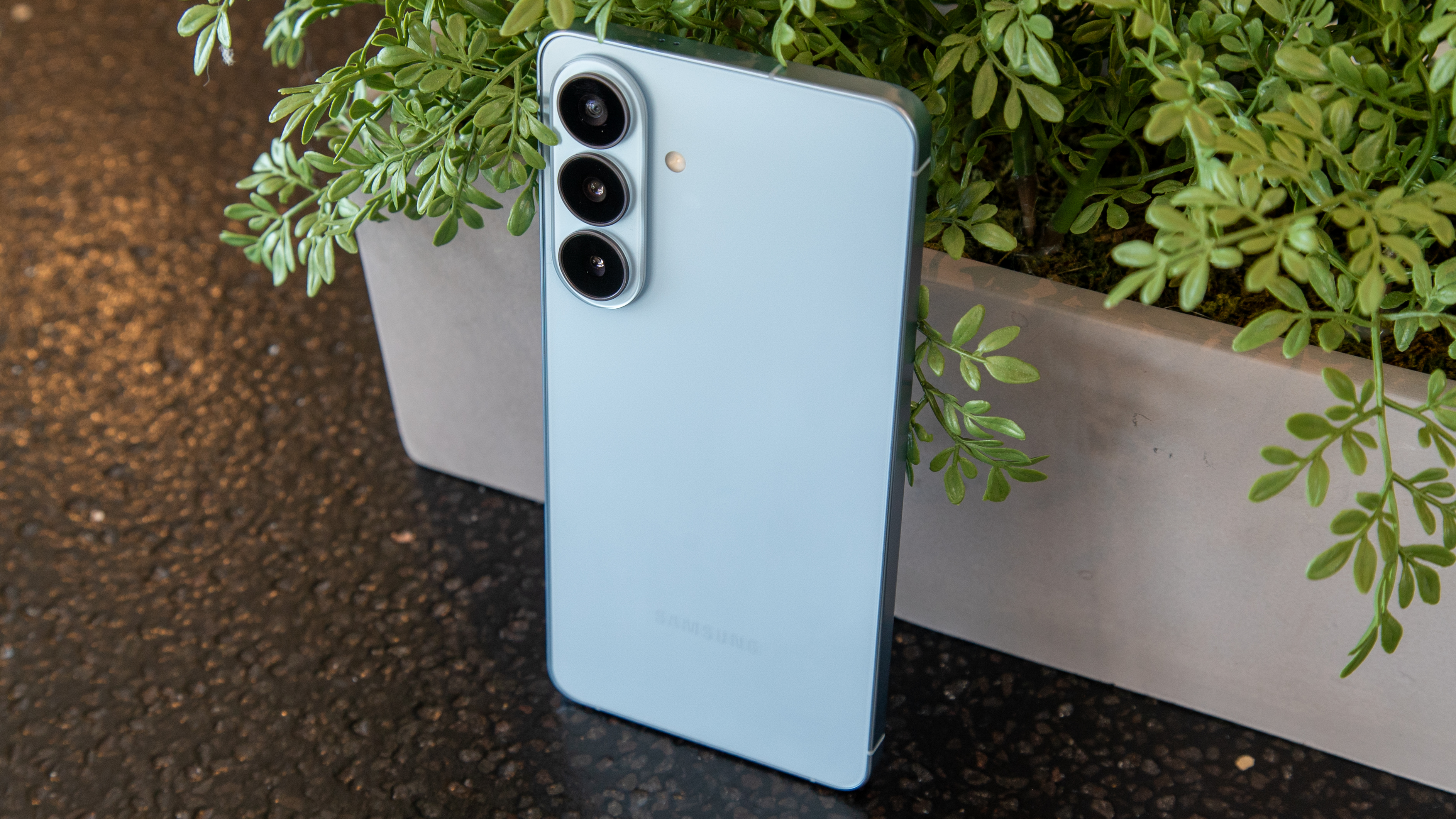 Galaxy S26 Plus in front of a planter
