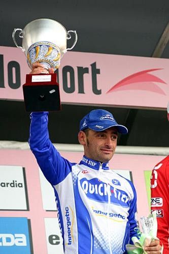 Bettini (Quickstep) holds up the trophy