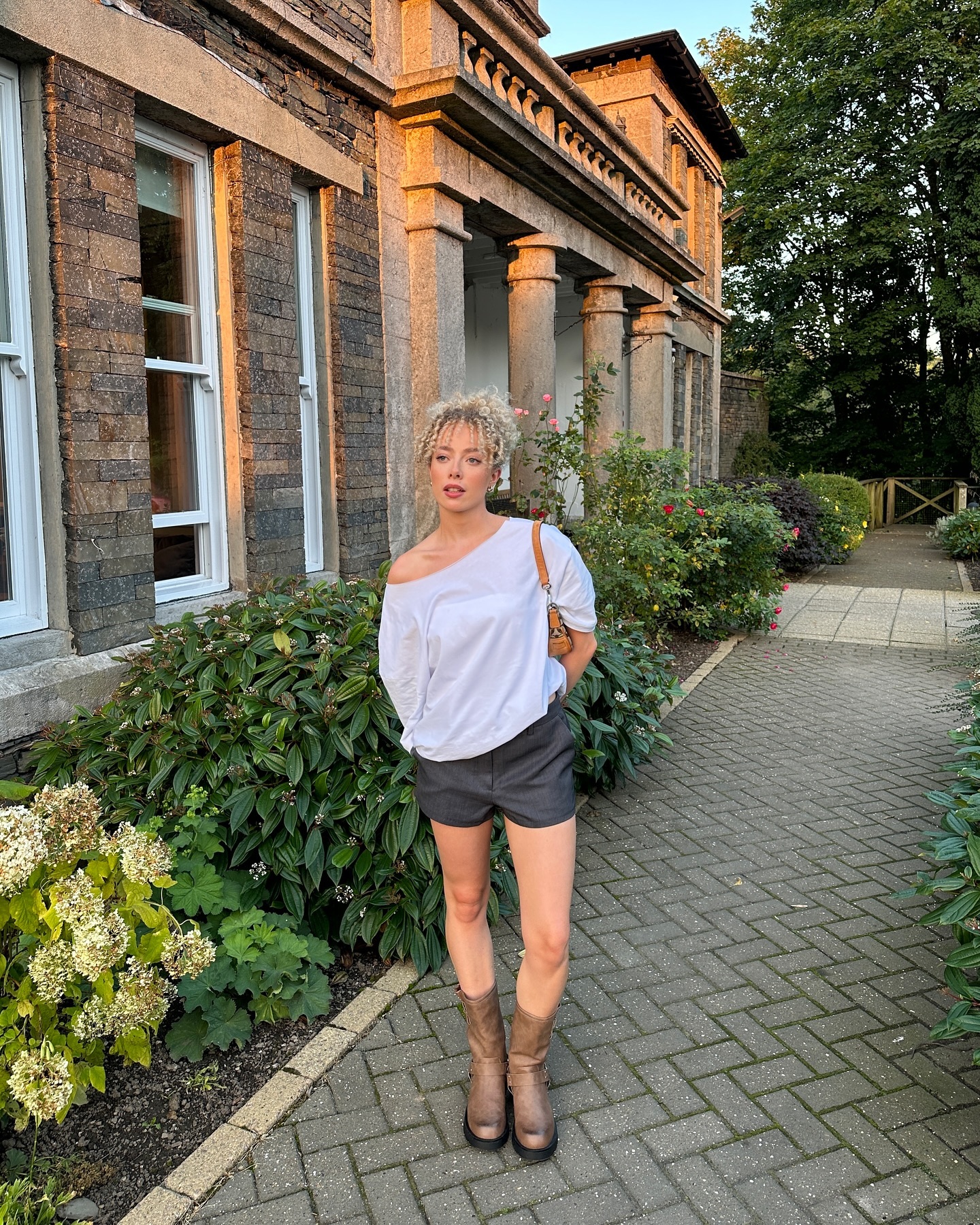 An image of @martha.christiann wearing tailored hot pants.