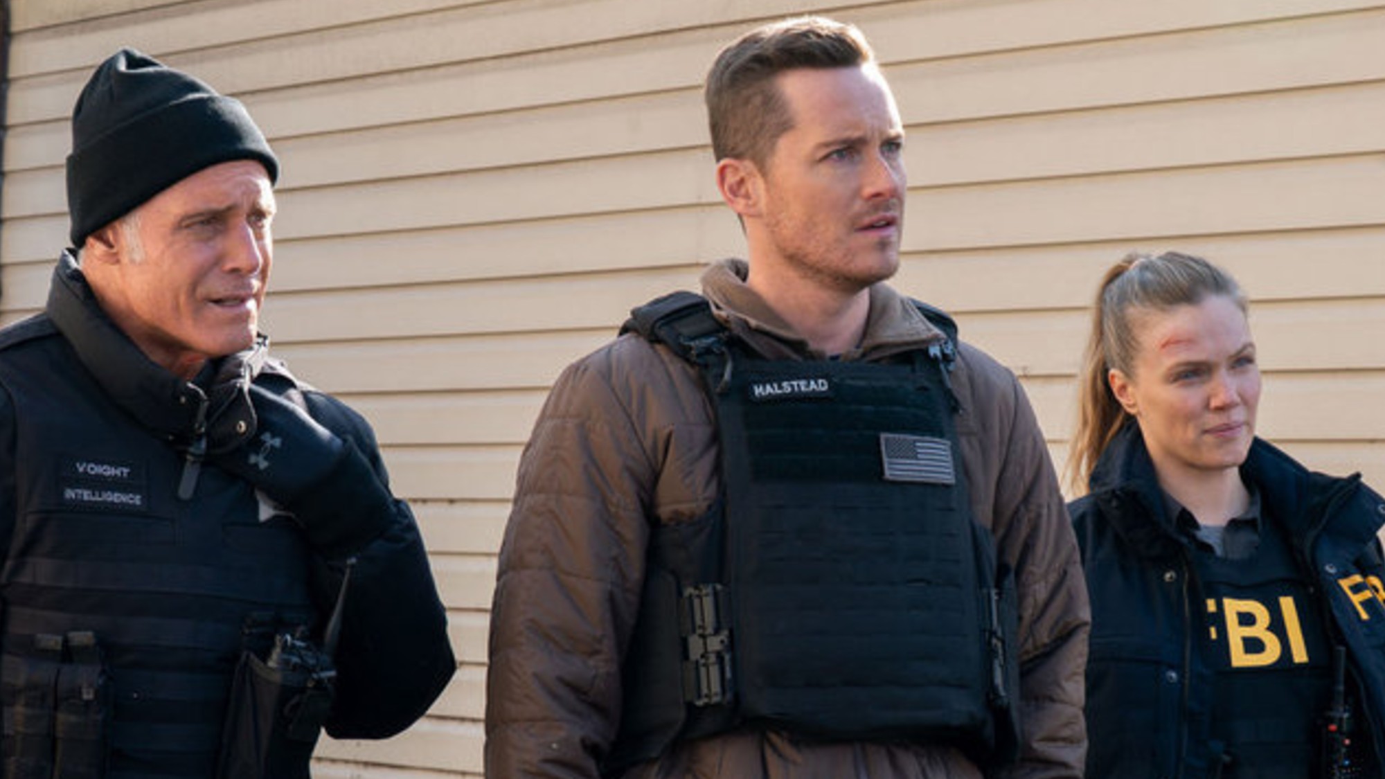 Voight, Halstead, and Upton standing next to each other on Chicago P.D. for the One Chicago crossover.