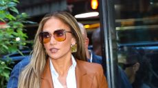 A HEADSHOT OF JENNIFER LOPEZ WEARING SUNGLASSES