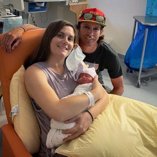 Peter Stetina poses alongside wife Dyanna and baby girl Layla in a San Francisco hospital in July 2022