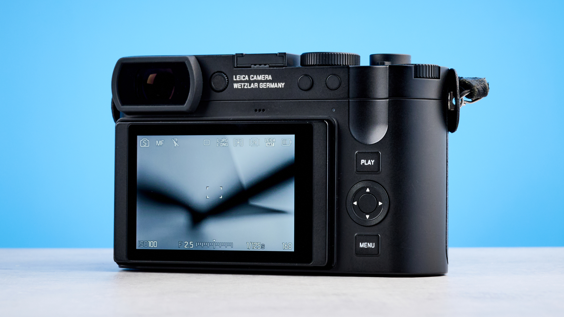 A black Leica Q3 Monochrom black-and-white mirrorless camera