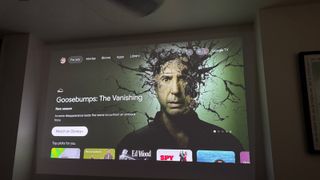 Google TV home screen projected onto a wall by the XGIMI MoGo 3 Pro projector