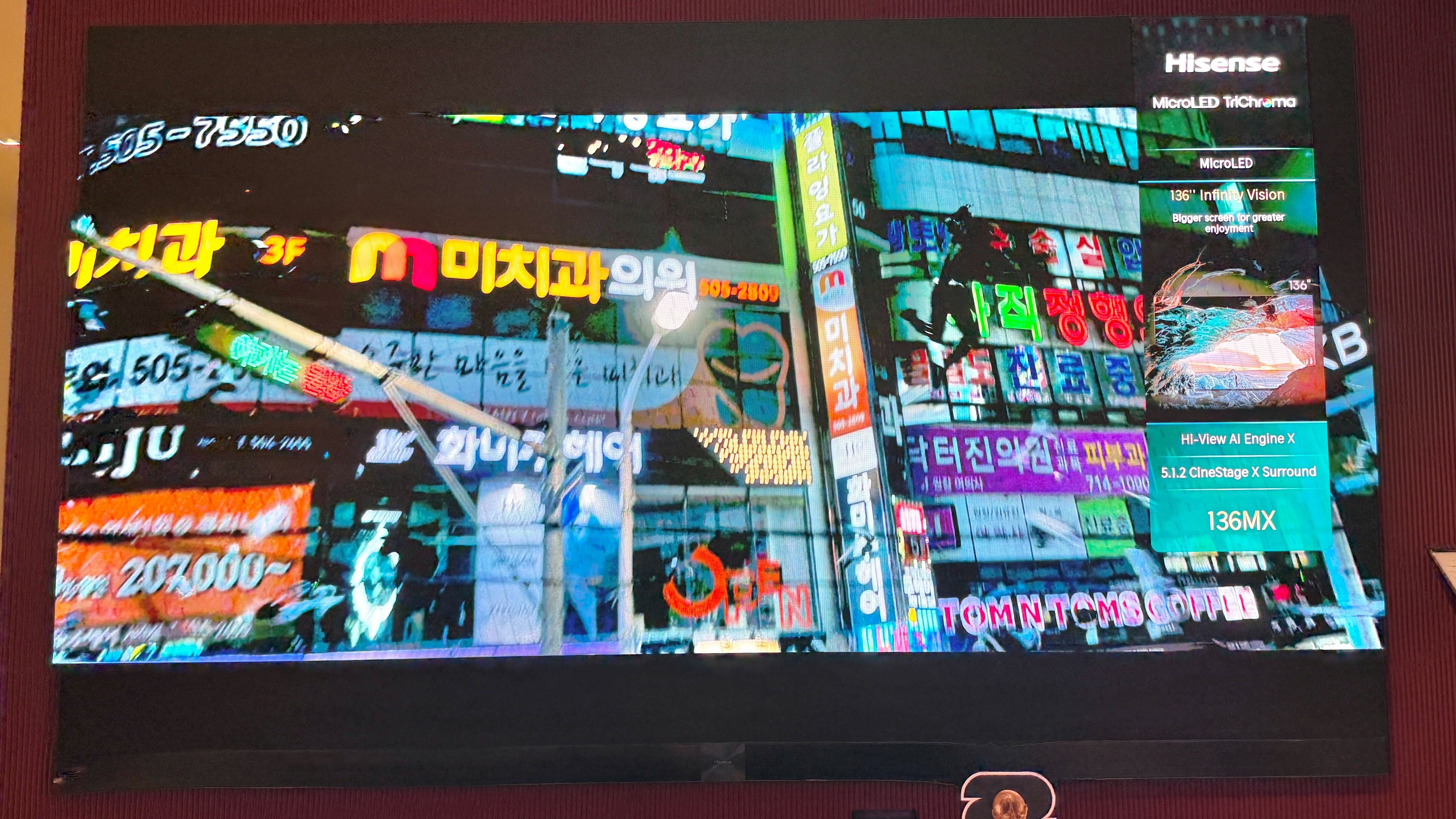 Wall mounted Hisense Micro LED playing a scene from Black Panther on screen