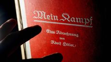 (FILES) - Picture taken on June 14, 2005 shows a man reading a signed copy of a first edition of Adolf Hitler's book Mein Kampf at Bloomsbury Auction House.Authorities in the southern German 