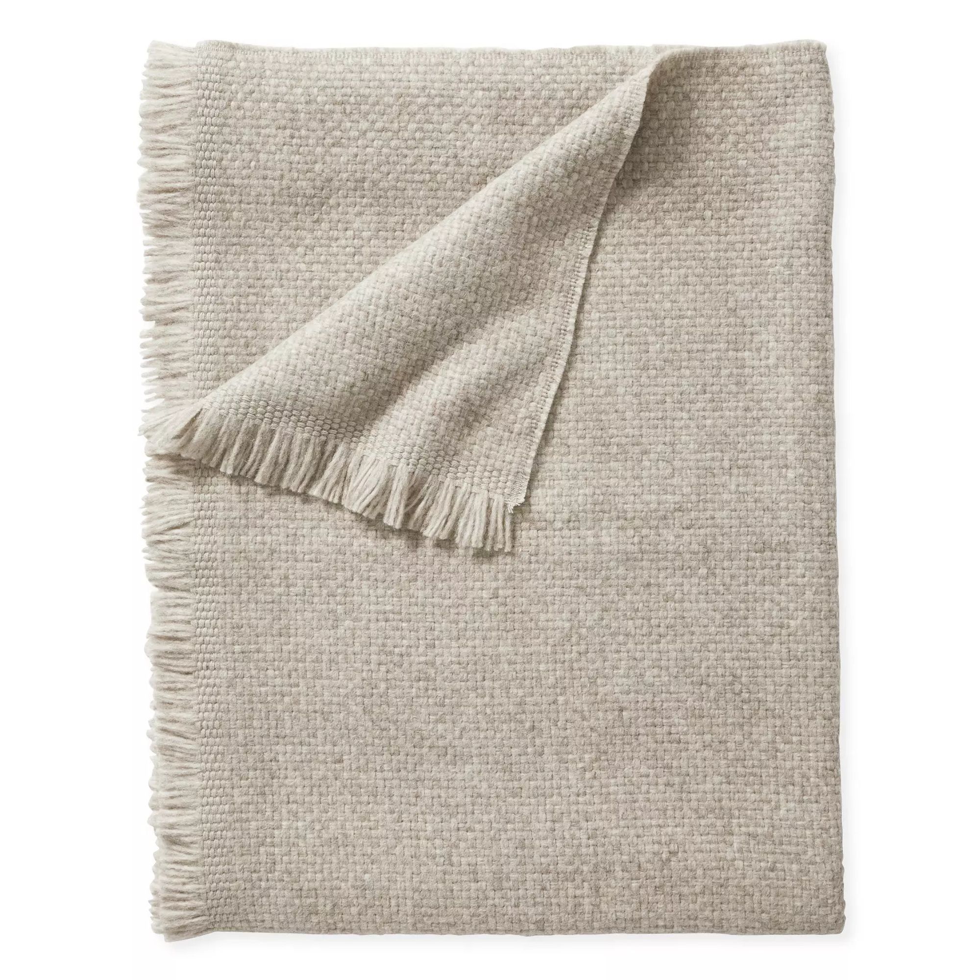 Beige throw blanket with tasselled edge