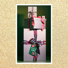 Gold glitter background overlaid with image of wrapped presents 