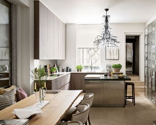 Kitchen with island seating and dining table