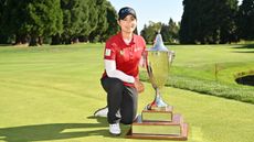 Moriya Jutanugarn poses with the Standard Portland Classic trophy following her win in 2024