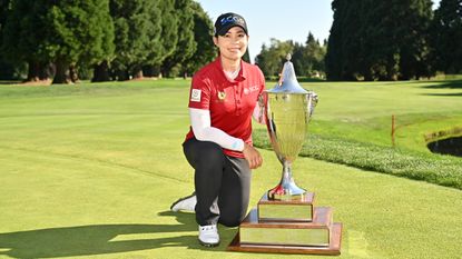 Moriya Jutanugarn poses with the Standard Portland Classic trophy following her win in 2024