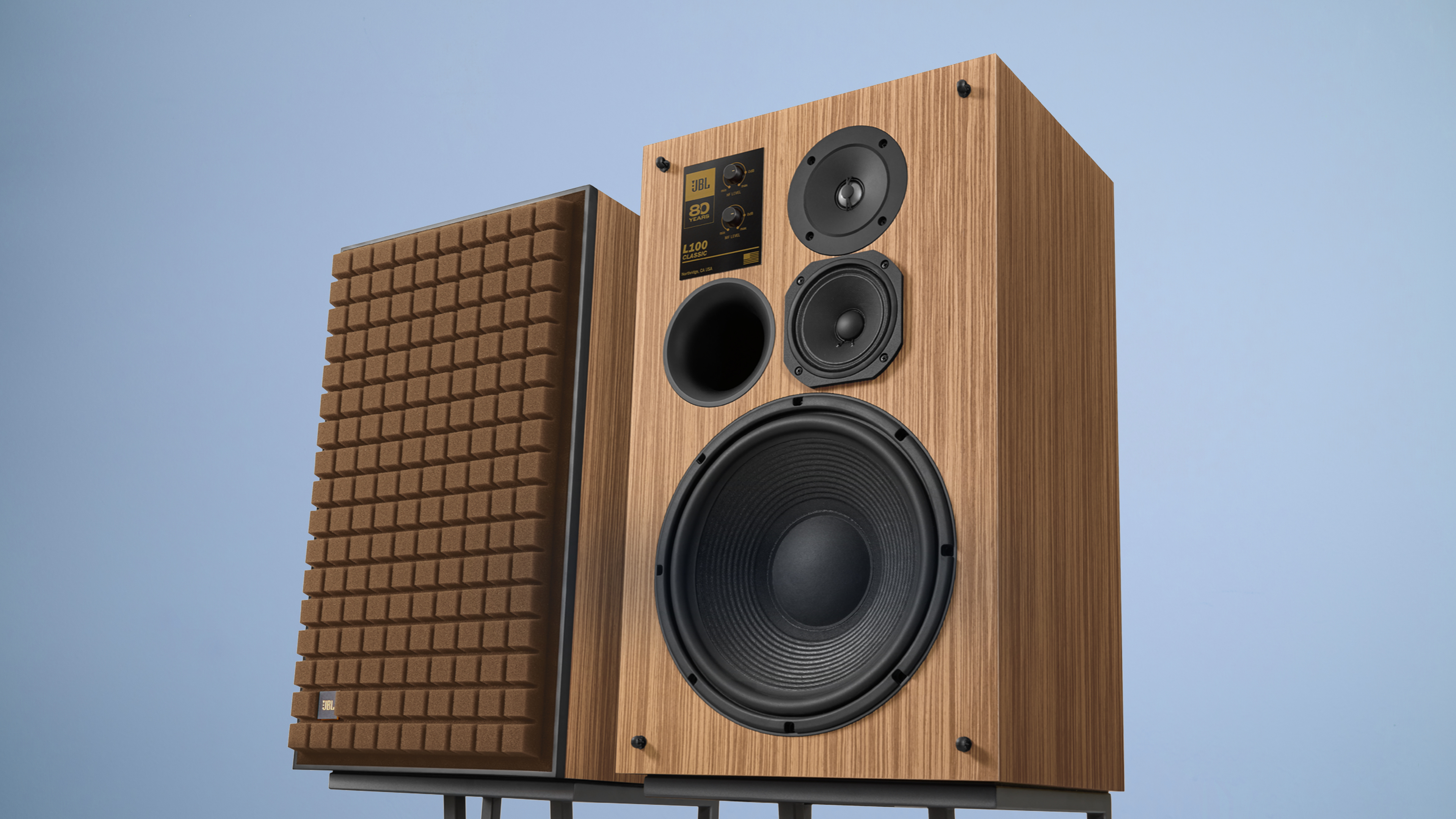 The JBL L100 Classic 80 on a blue background