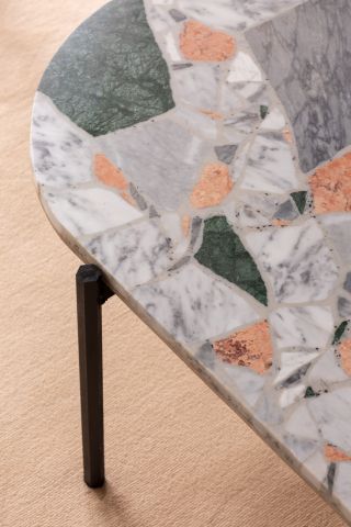 A terrazzo-style table features in the Airbnb apartment