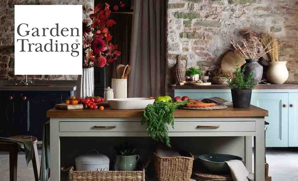 Garden Trading logo placed over a dining table with fresh veg and flowers