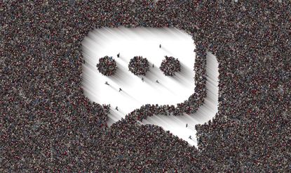 A large crowd of people forming a speech bubble symbol.