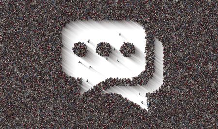 A large crowd of people forming a speech bubble symbol.