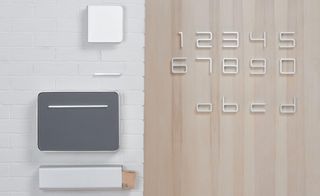 'Entrance', by Jehs and Laub for Authentics. A series of thin white numbers and letter on a wooden wall.
