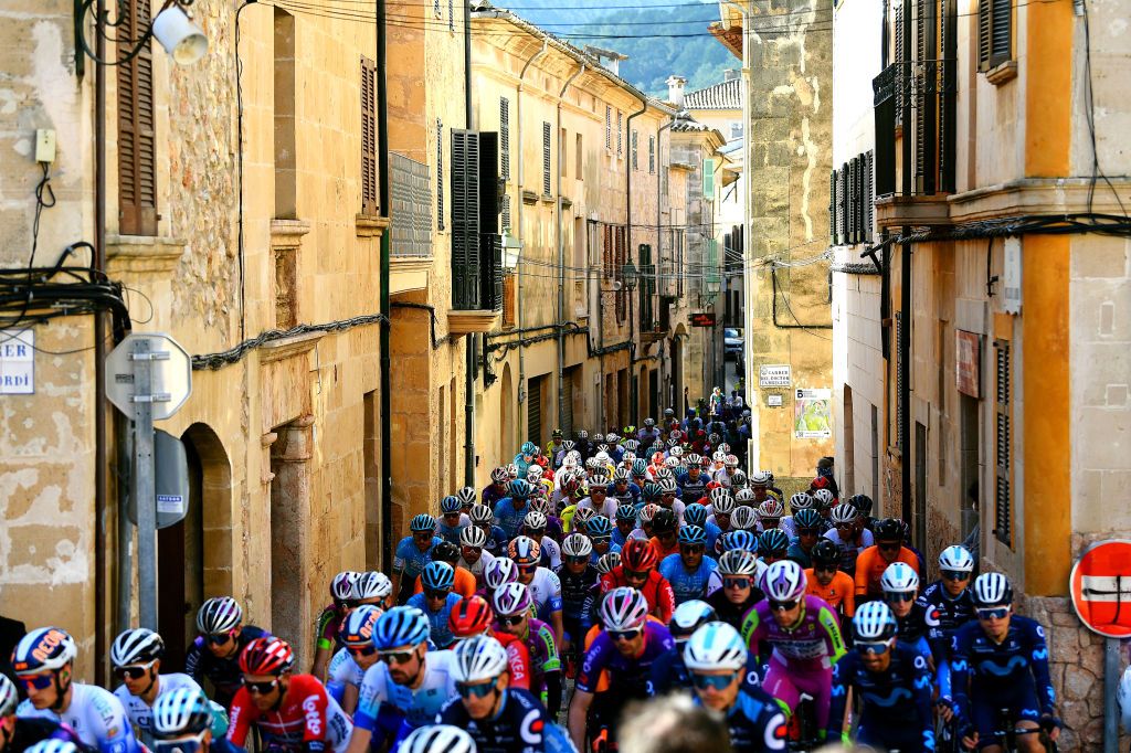 ANDRATX SPAIN JANUARY 29 A general view of the peloton passing through Carrer del Doctor Fabregues in the village of Pollena at start the 31st Challenge Ciclista Mallorca 2022 Trofeo Pollena Port d Andratx a 170 km race from Pollena to Andratx 214m ChallengeMallorca on January 29 2022 in Andratx Spain Photo by Dario BelingheriGetty Images