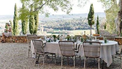Some of the best outdoor furniture - Dining table set on patio garden in French countryside.