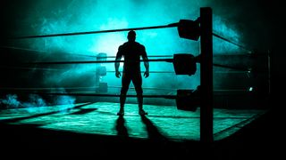 A shadowy figure stands in a pro wrestling ring, surrounded by smoke, in the art for Dark Side of the Ring on Vice.