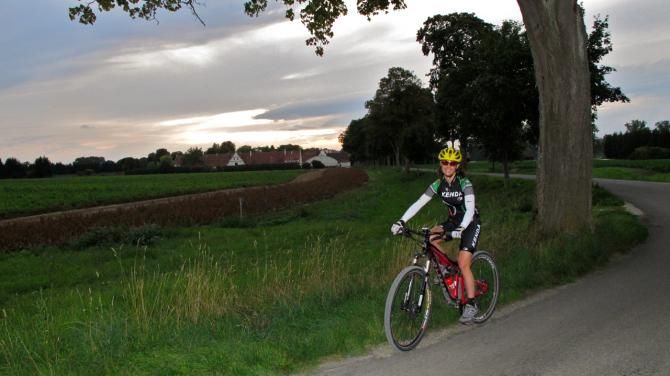 Mary McConneloug training with flat pedals while her ankle heals