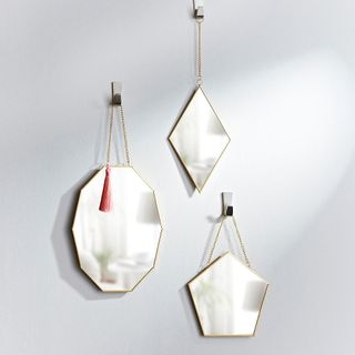 mirror with white wall and hanging on wall