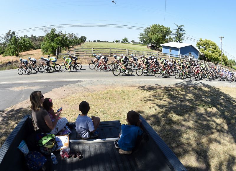 Spectators enjoy the race from the back of a ute
