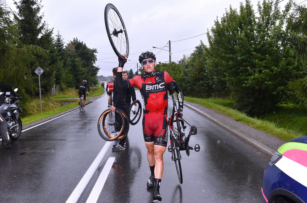 Floris Gerts (BMC) waits for a new rear wheel