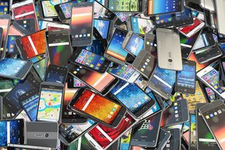 An image of a pile of mobile phones all on top of each other