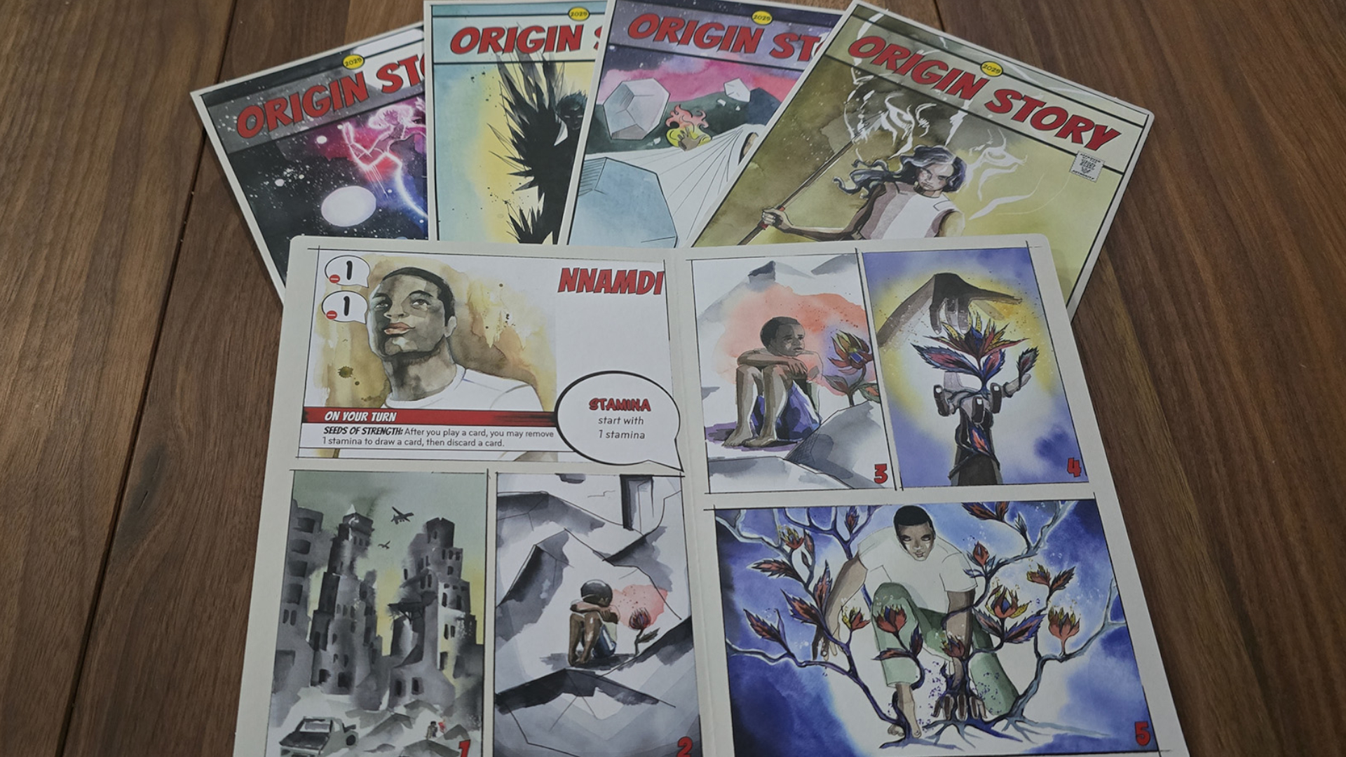 Origin Story comic book-style rulebooks on a wooden surface