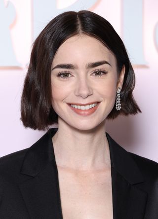 Lily Collins attends the "Emily In Paris" Netflix Photocall at La Samaritaine on September 12, 2024 in Paris, France