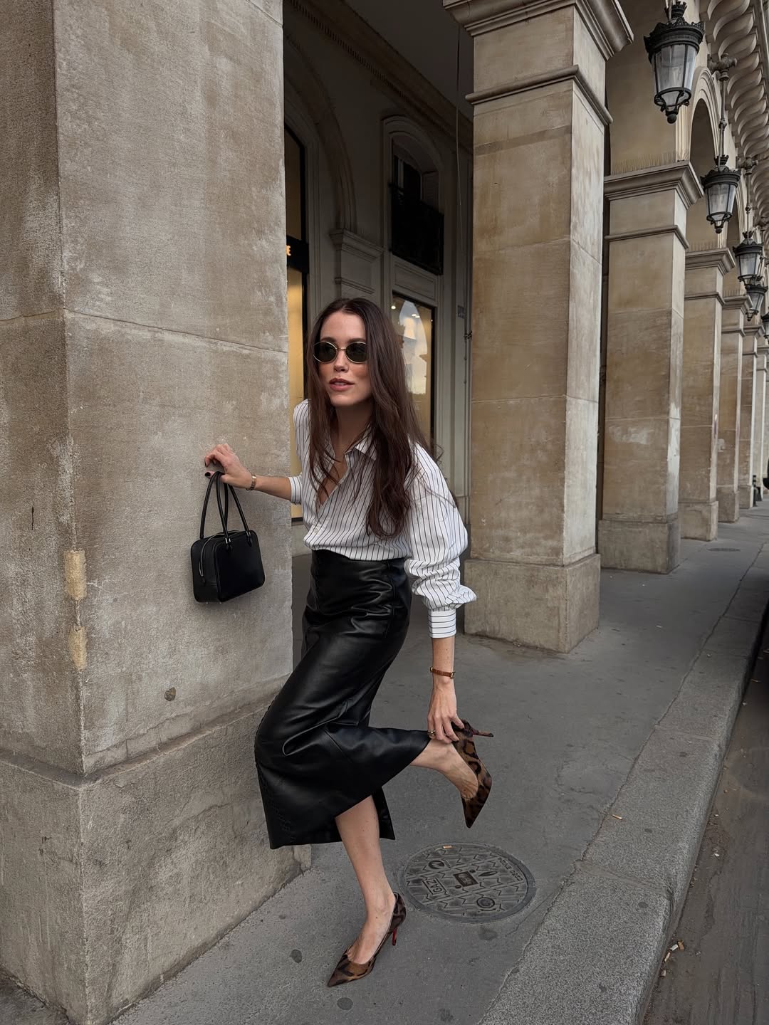 Women on street wearing the Christian Louboutin Miss Z Leopard Print Pumps