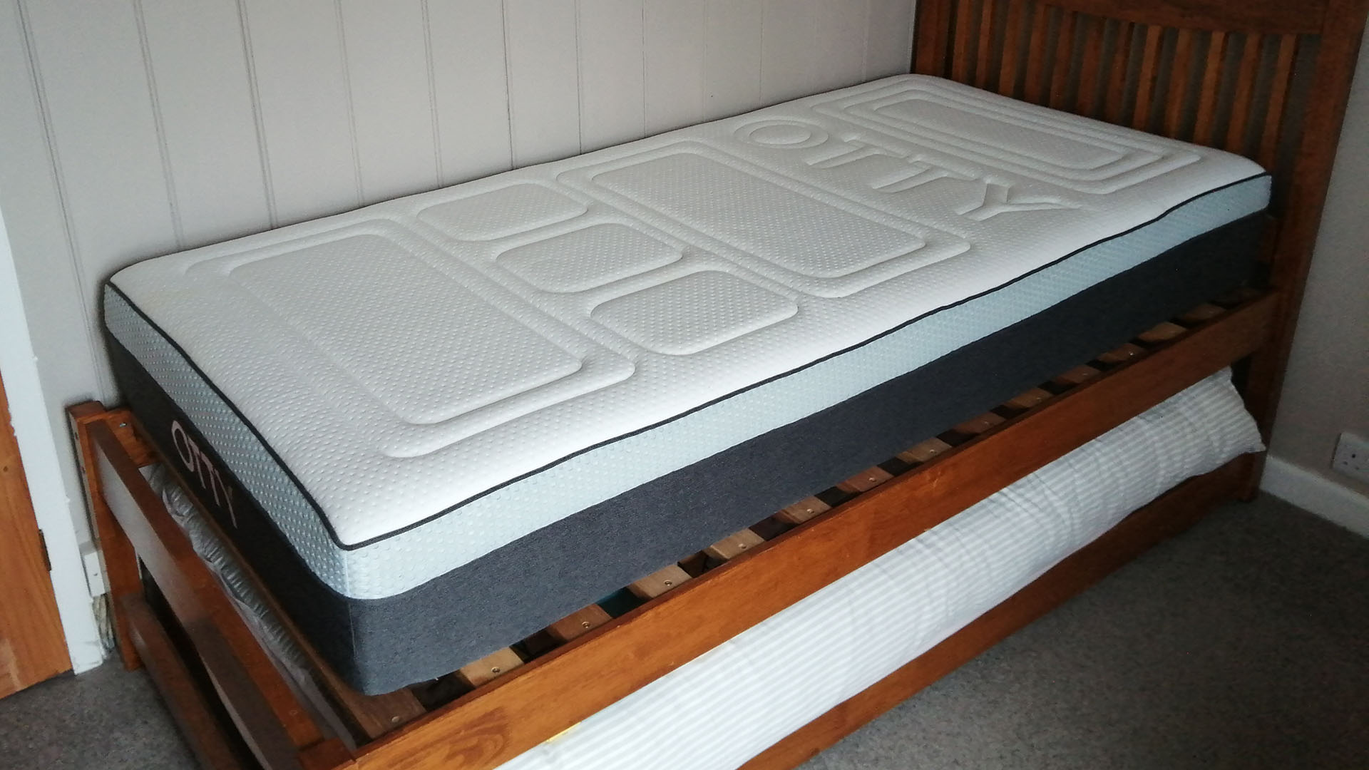 Otty Pure mattress on a wooden bed frame in reviewer's bedroom