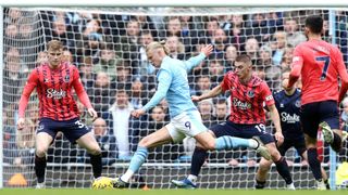 Manchester City's Erling Haland turns to shoot during the Premier League match between Manchester City and Everton FC at Etihad Stadium on February 10, 2024 in Manchester, England. 