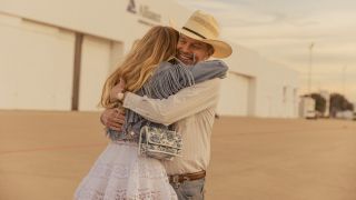 Billy Bob Thornton's Tommy hugging his daughter and smiling.