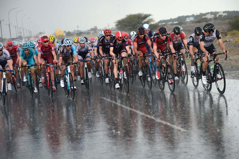 The rain falls on the peloton during stage 3 of the Tour of Oman