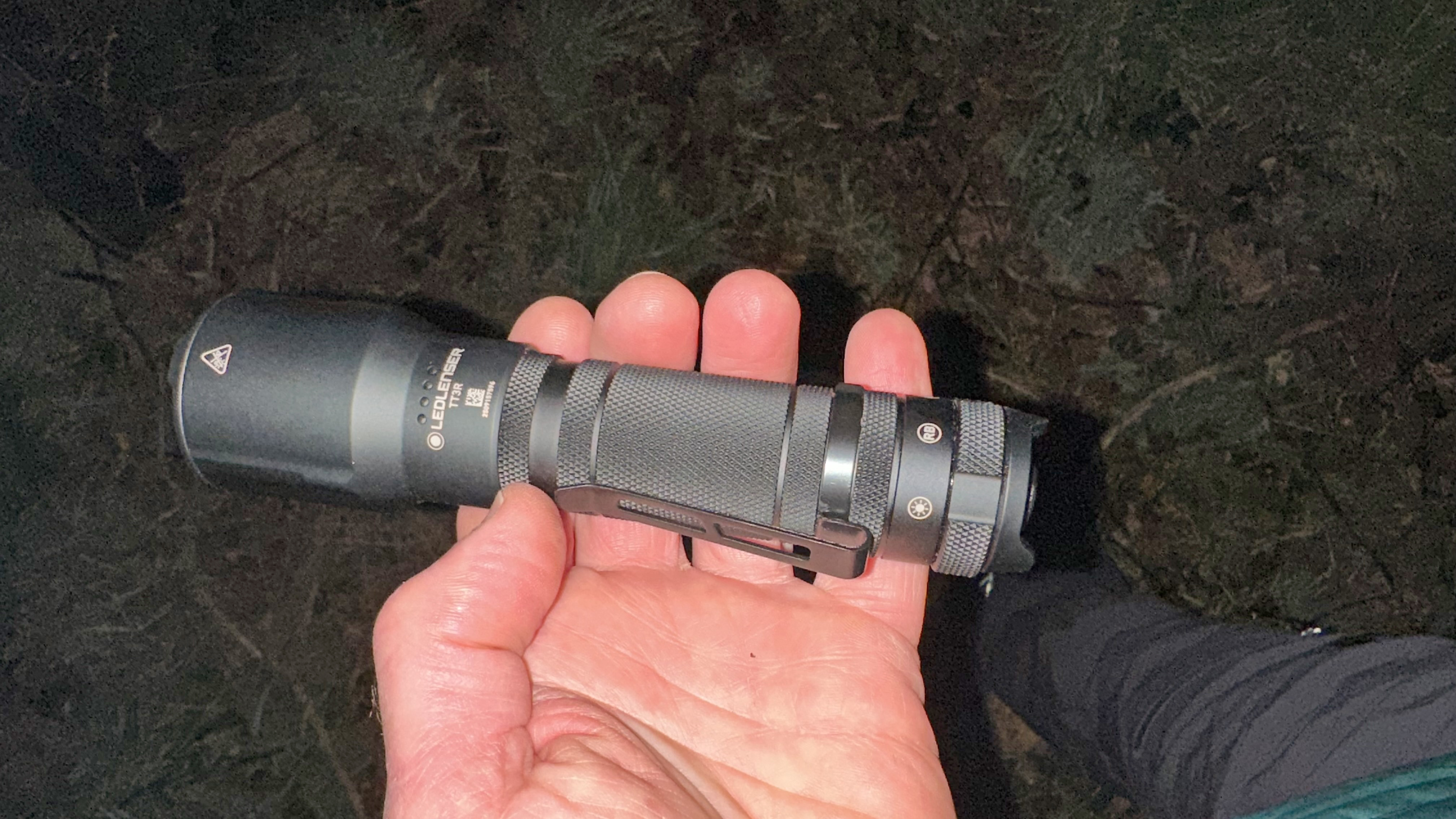 The Ledlenser TT3R being held in the hand