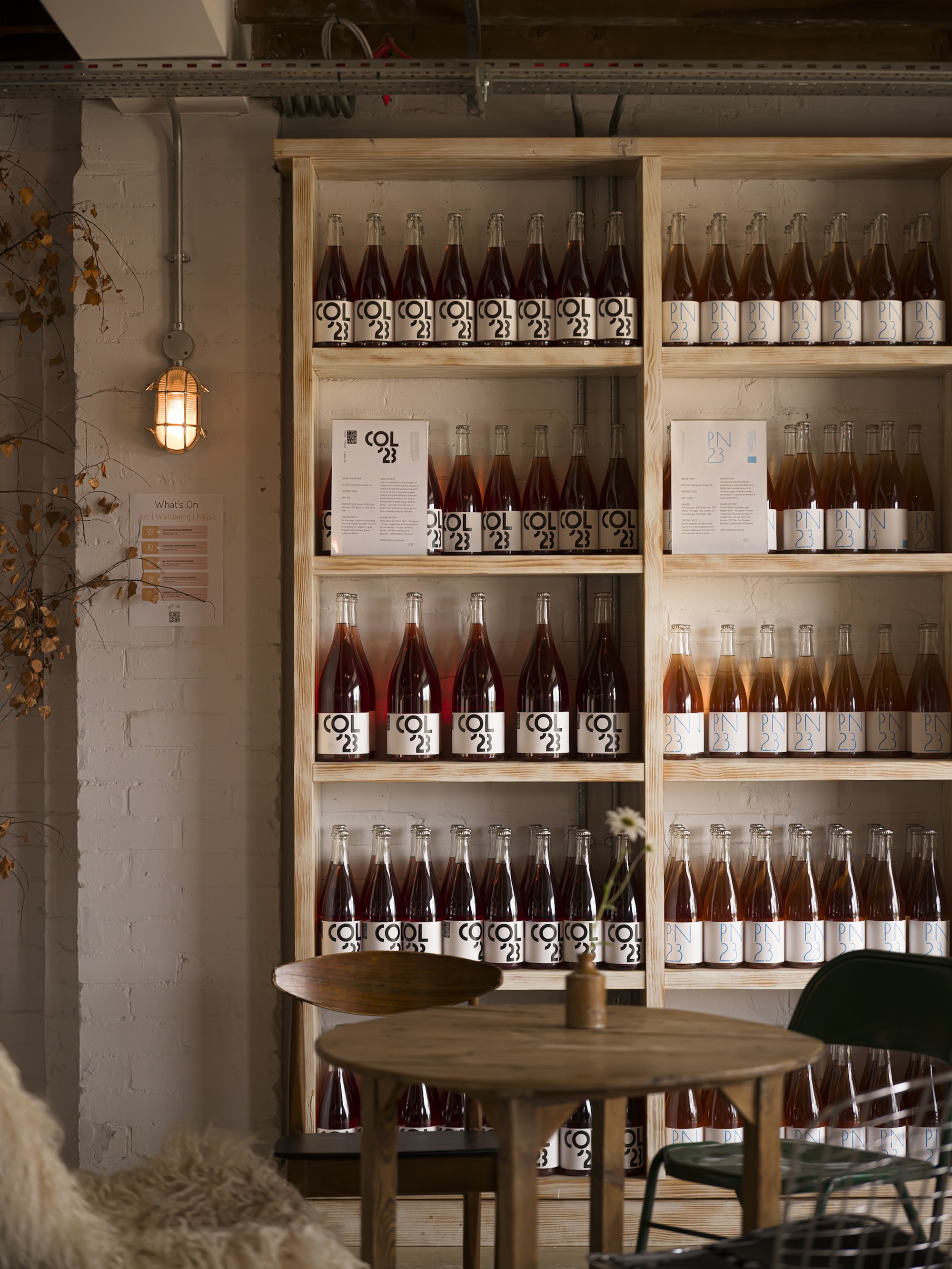 a wine bar with bottles of low intervention wine on a shelf