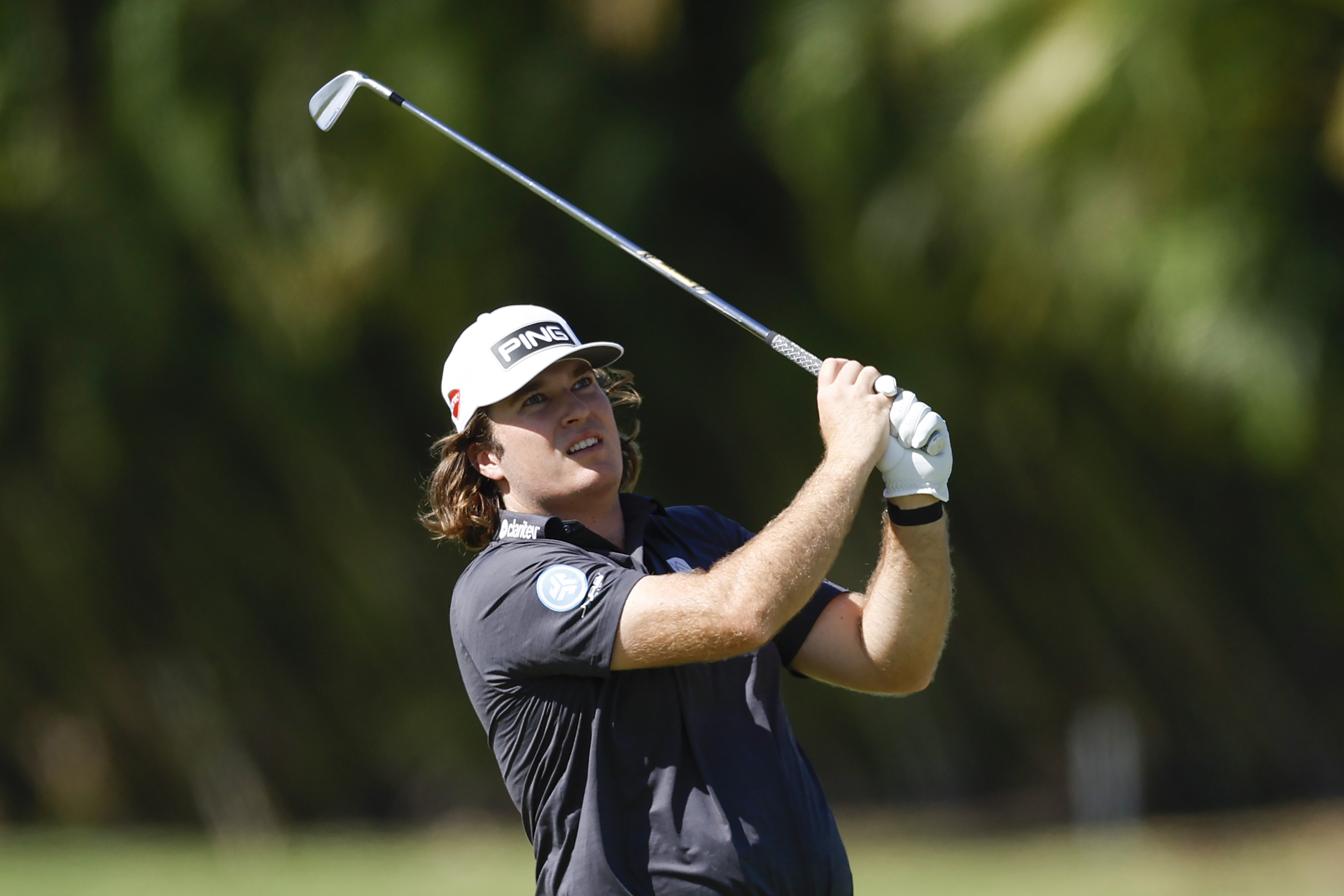 Neal Shipley hits an iron shot from the fairway