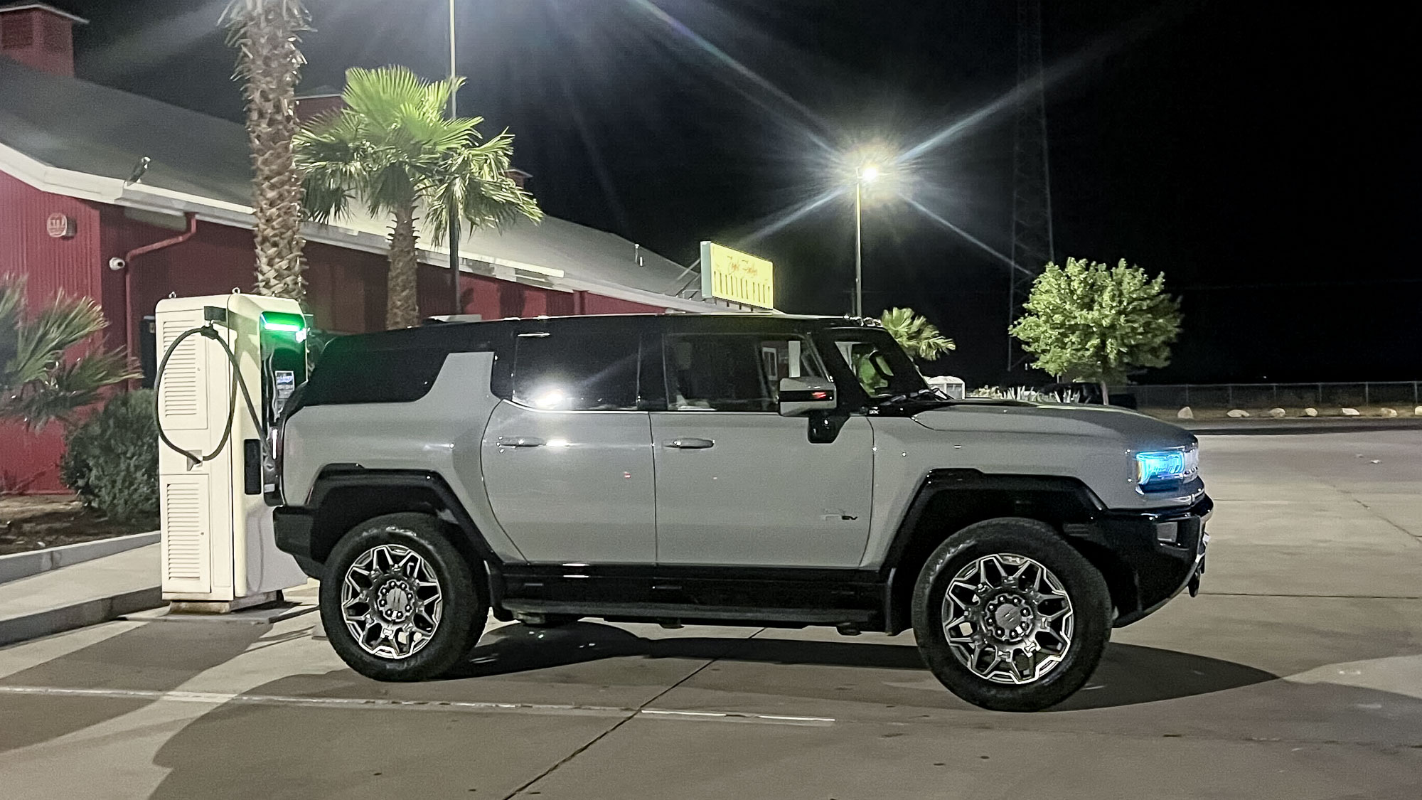 2025 GMC Hummer EV 3X SUV parked at a charging station