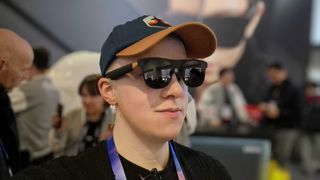 A man wearing Xreal One Pro glasses, at the CES 2025 show