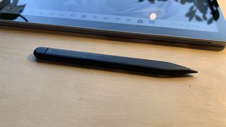 Microsoft surface go 4 with stylus next to it