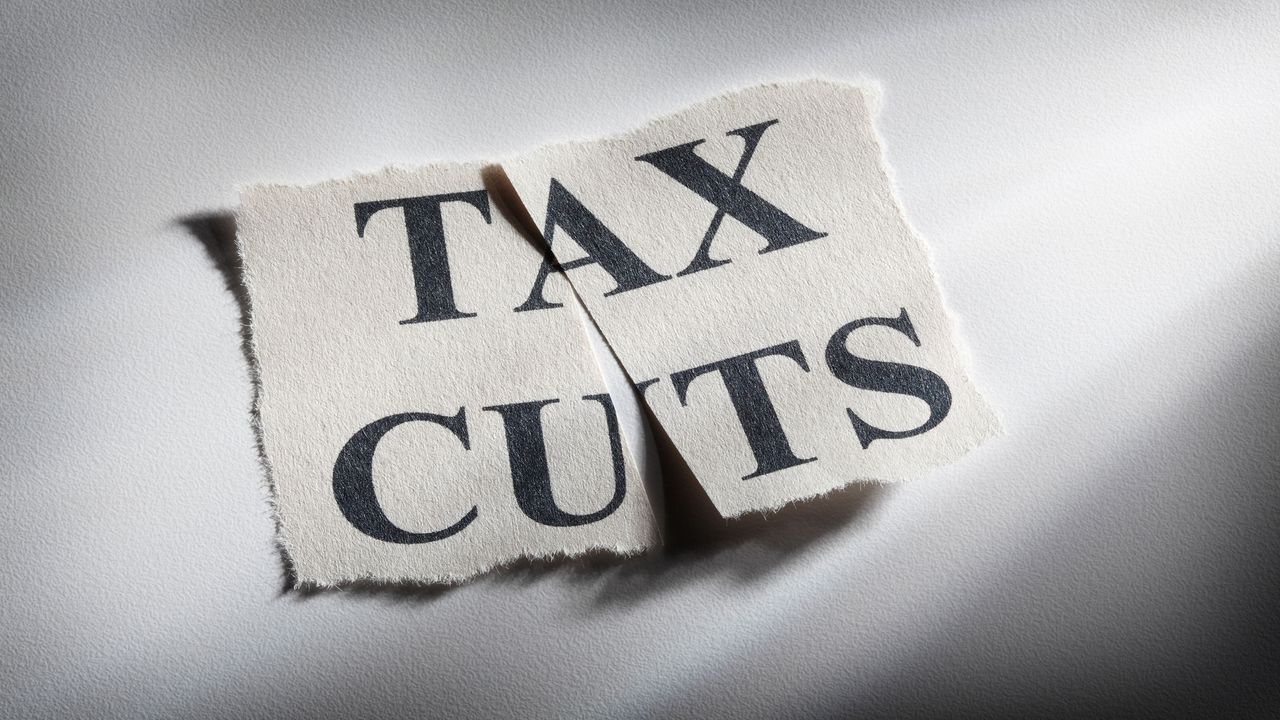 picture of a piece of paper with &amp;quot;Tax Cuts&amp;quot; written on it that has been cut in half