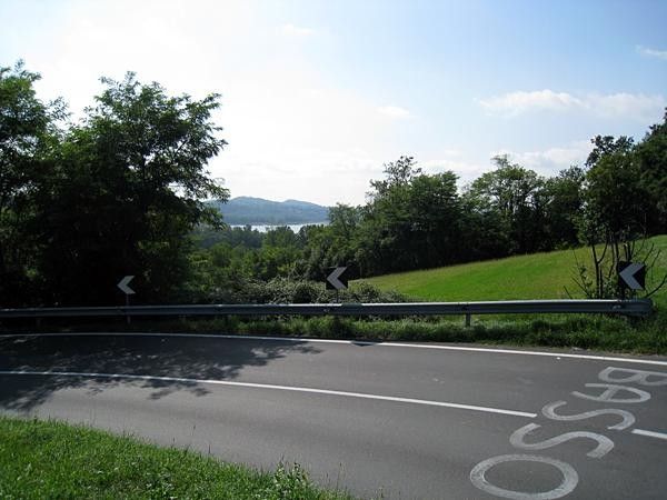 Ivan Basso's name marks the road with Lago di Varese back behind.