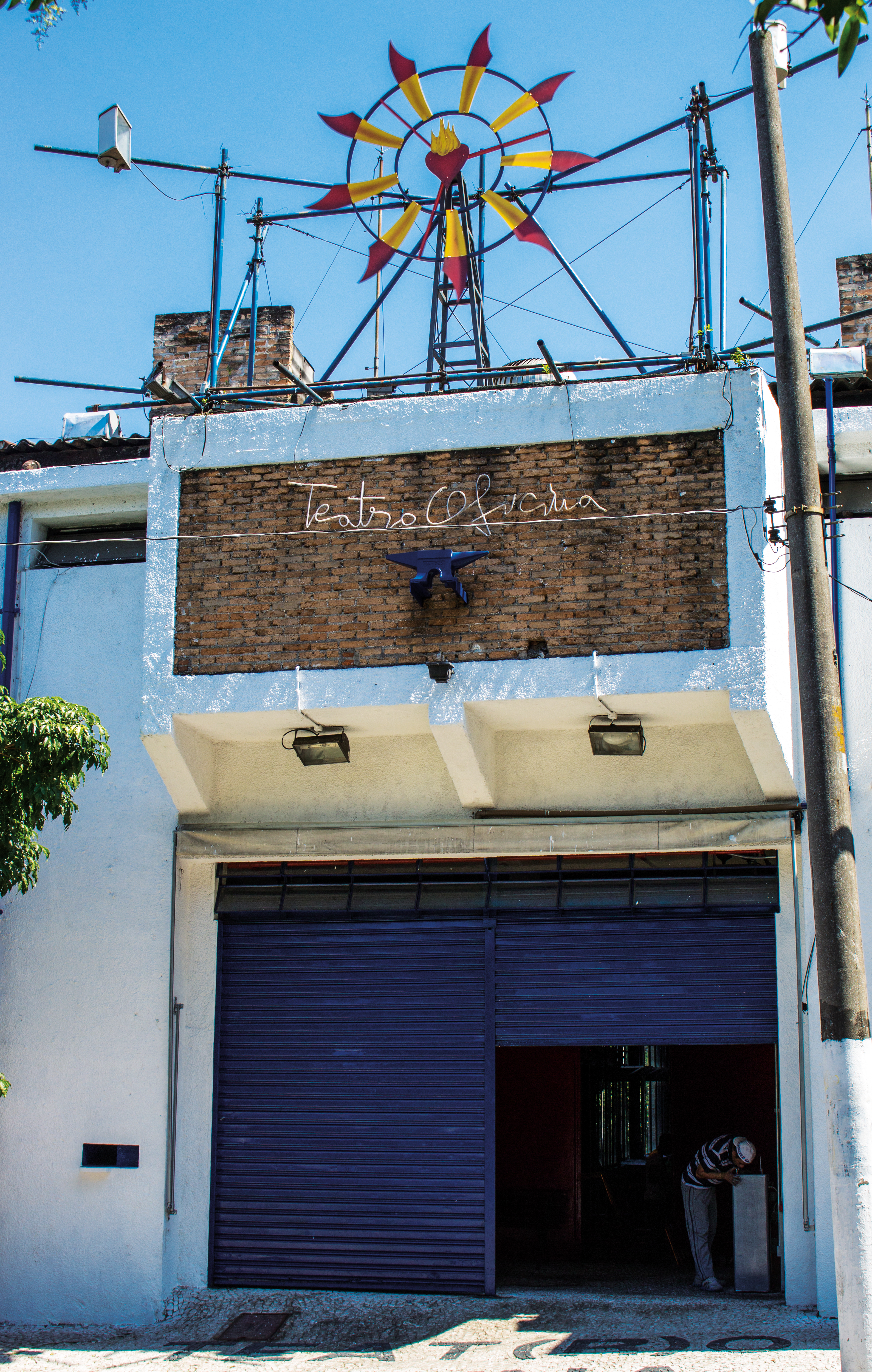 facade of teatro oficina by lina bo bardi in brazil with windmill on top